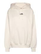 W Essential Hoodie Sport Women Sport Clothing Sport Sweatshirts & Hoodies Sport Hoodies Cream The North Face